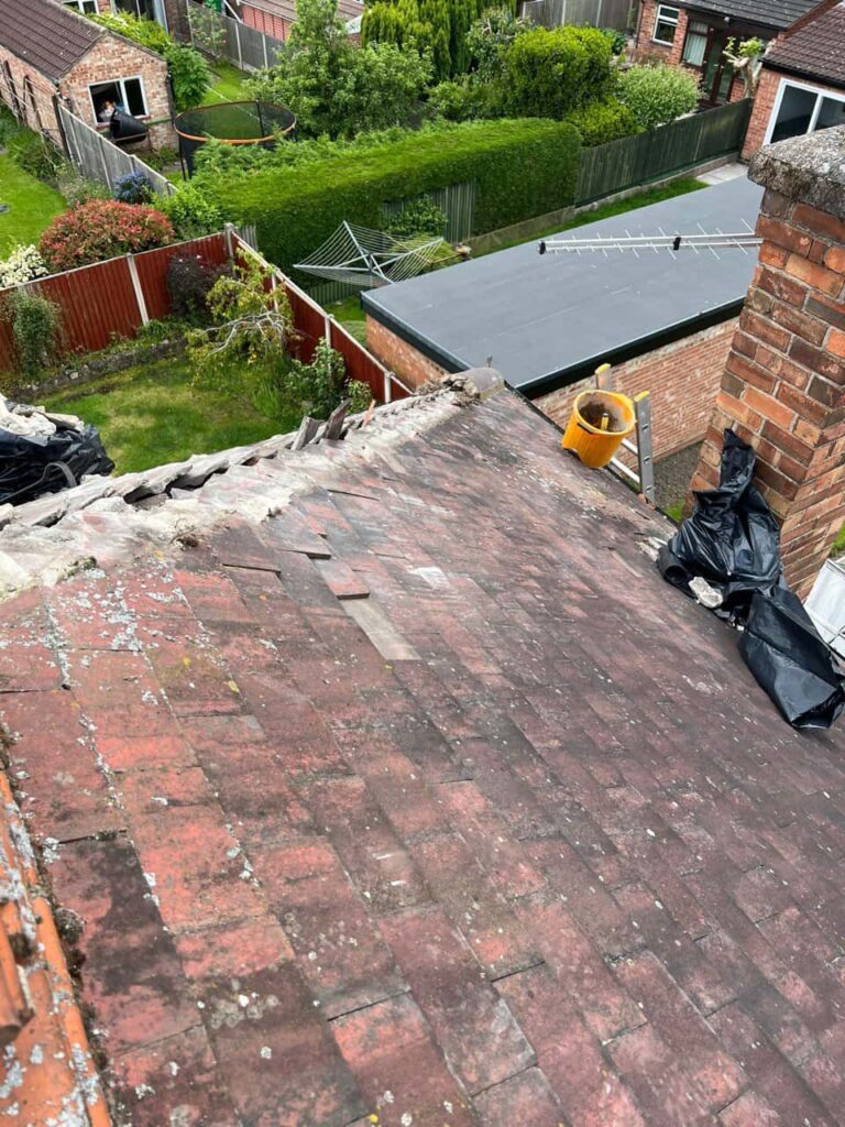 This is a photo of a roof where the hip tiles have been removed, and are just about to be replaced. Works carried out by MCM Roofing Repairs Ringwood