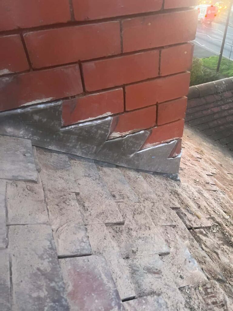 This is a photo of new leadwork being installed around an old chimney. Works carried out by MCM Roofing Repairs Ringwood